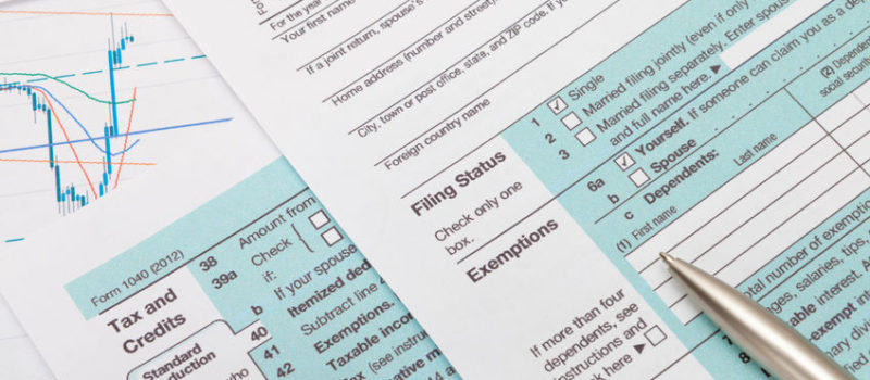 US 1040 Tax Form and silver ball pen